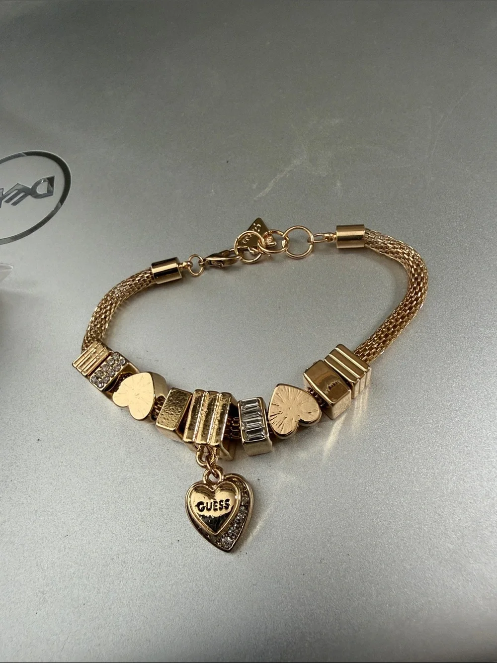 Gold color Guess mesh. Charm bracelet 8”.   NWOT.  Beautiful